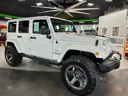 Experience the thrill of off-road adventure in the meticulously crafted 2017 Jeep Wrangler Unlimited Sahara 4x4. With...