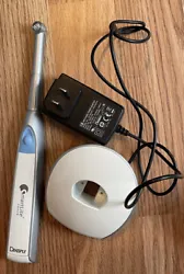 Densply Sirona SmartLite Focus Pen-Style LED Curing Light. Includes charger and additional sleeve covers.