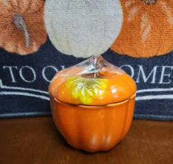 This orange pumpkin ceramic jar is perfect for storing your favorite treats this fall season. With its festive design,...