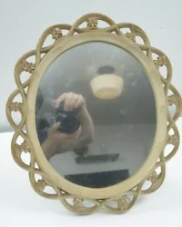 Small black dot under mirror pointed out in image #2.