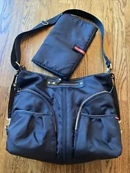 Excellent used condition, like new! This Skip Hop diaper bag is a versatile accessory for parents on the go. With its...
