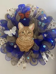 • This is a Brand new. Tiger kitty Mesh Wreath. I used a very pretty blue and tan deco mesh on a wire frame. I made...