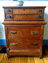 The bottom drawer is signed. I believe it was made in N.Y. The top two drawers have the bin pulls. It is a nice compact...