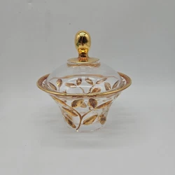 This vintage candy dish is a beautiful addition to any collection. The clear crystal material is accented with a gold...