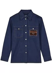 GUCCI Blue denim shirt. In homage to the house’s historical archives, Gucci’s denim shirt is adorned with an...