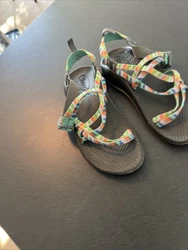 Elevate your shoe collection with these stylish and comfortable sandals from Chaco. These strappy sandals feature a...