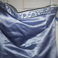 The front is blue Gray color with hand beaed top bodice edge. It is strapless with a built in bra pad to raise you up...