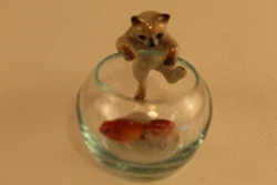Cat climbing into Fish Bowl, 3 pieces: cat, glass bowl and fancy fish. very cute. Cat fits securely on bowl....