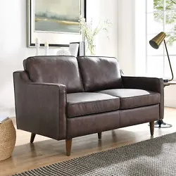 Smartly upholstered in durable, genuine top-grain leather, this modern loveseat enlivens mid-century modern, eclectic,...