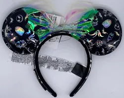 Minnie Mouse ears with simulated leather material, all over character print, and transparent iridescent bow. Nightmare...