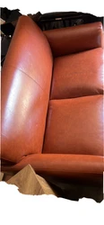 A futon couch rustic in color made with faux leather is for SALE!