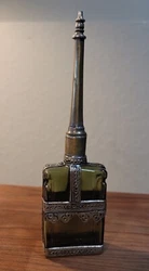 The bottle has a screw-on sphere and overlay. The overlay material is not known. The height of the bottle can be seen...