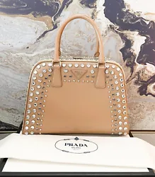 Authentic beautiful Prada Vernice Crystal two-tone pyramid satchel bag. This chic tote is crafted of Prada cross-grain...