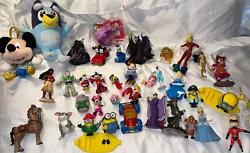 This lot includes various Disney figures and plushies, perfect for any Disney fan or collector. The assortment includes...