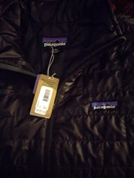 Made of durable polyester, this puffer jacket is perfect for cold weather and outdoor activities. Color -Black.