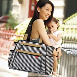 The Grand Central diaper tote magically combines a compact modern style with an uncanny ability to hold more than you...