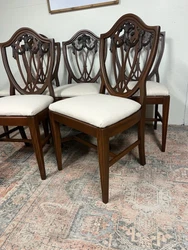 Beautiful set of dining chairs, 4 side chairs and 1 arm chair. They are solid and sturdy with minor issues to the wood....