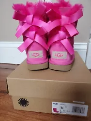 Hot Pink Ugg Boots. Toddler girl Size 6. Beautiful hot pink color fur and ribbon! Used one time but do not fit anymore....