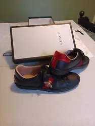 Gucci Ace leather shoes. Gently worn. Has a few scuff marks as seen in photos. Comes with original box, extra pair of...