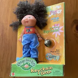 There are a few marks on her face and some dust. There is a stain on her pants. Please see pictures.CABBAGE PATCH KIDS...