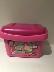 This is a Lego Duplo Empty Brick Duplo Storage Container with Lid. The bottom of container is Pink and the lid is a...