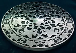 Anearlyantique sterling silver andglass trivet ,most probablycirca 1890 ,¹in a swirling pierced floral pattern of...