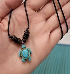 Sea Turtle Necklace. Hanmade with Black Cord, Turquoise color turtle charm pendant and black wooden beads. Wear it as a...