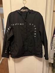 Supreme Black Jacket/windbreaker Size M.Has Velcro straps near the zipper for closure