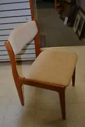 I believe it is teak. This is a single dining or office/desk chair by Sun Furniture. Sleek wooden, mid century look,...