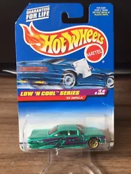 1998 Hot Wheels Low N Cool #698 - 59 Impala, 1:64 scale, NOC 18780. Please see pictures for overall condition. I...