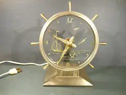 The is a rare vintage Maddon Products Co. Model 85 nautical mystery clock branded as The Commodore.  The glass facing...