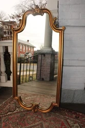 This mirror appears to be all original with the original back with hanging instructions, and the mirror is in very good...