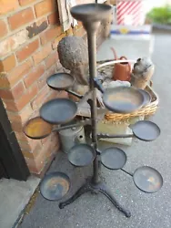 Cast Iron Swivel Plant Stand. Heavy, Complete, 12 Pot Holders. Uncertain of what material pot holders are. Height is...