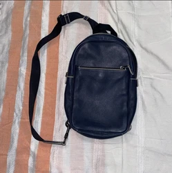 Coach Track Pack in Signature Canvas - Gunmetal/Bright Blue. It has a small tear in the front part, it is hardly...