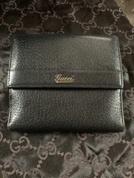 Gucci Black Leather Gold Script Logo Wallet.