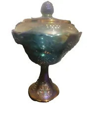 This vintage blue carnival glass candy dish is a stunning addition to any collection. Made by Indiana Glass in the...