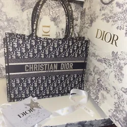 This Christian Dior Oblique Book Tote is the perfect addition to any fashion-forward womans wardrobe. With its small...