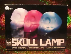 Fifty Battery Powered Skull-Shaped Desk Lamp. Made of sturdy colored plastic. Made of: Plastic. Made in: China.
