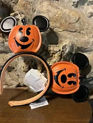 Get into the spooky spirit with these Disney Parks Mickey Mouse Jack o Lantern Pumpkin Ears Headband! Perfect for...