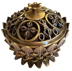 This small bronze-tone antique-style incense burner can be used with cones or granular incense. A mini and lovely...