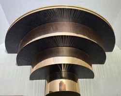 Gold toned mirror facets around the outside edge and a glass mirror top. This is an unusual piece.