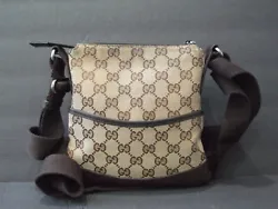 Gently used small Gucci canvas crossbody bag with perforated leather bottom.  Lightweight and small, but big enough to...