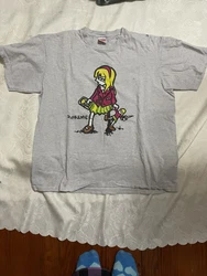 Mens Supreme grey tee shirt with graphic desigb of little girl. Limited edition. Pre owned. Hole on right upper...