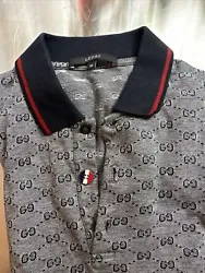Gucci Monogram Polo Shirt Men. Fits like a small. I replaced a button with a tom Browne button in red white and blue....