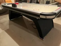 DMI Sports air hockey table. Electric scoring and sound affects. Electronically adjustable goal size. 8ft long by 4ft...