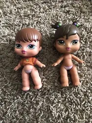 These dolls are pre-owned and do show some signs of wear. They both have some discolored marks on their faces and hair....