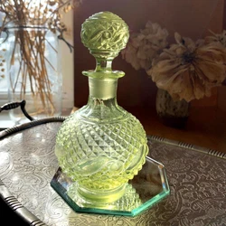 This is a stunning antique yellow vaseline scent bottle that I believe is made by Baccarat although it is unsigned.It...