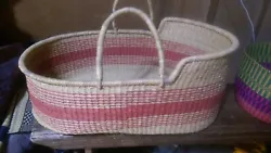 Baskets are hand woven with straw and are made in Ghana. Basket ha handles that enable carrying with ease.