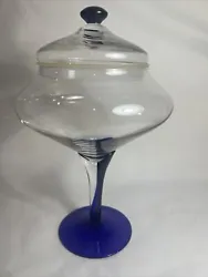 This beautiful vintage candy dish is sure to make a statement in any home. The stunning blue glass and unique pedestal...