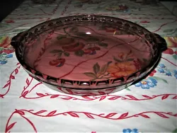Part of the Original series by Pyrex that is no longer in production. It has a fluted edge and scalloped handles.